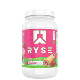 A container of Ryse Loaded Protein powder with a pink label featuring an image of a strawberry, indicating a possible flavor.