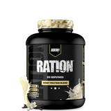 Ration whey protein tub next to a protein shaker