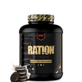 Ration whey protein tub next to a protein shaker