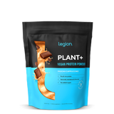 A sealed pouch of Legion Plant+ Vegan Protein Powder, Mocha Cappuccino flavor. The packaging is predominantly black and blue.