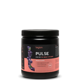 A container of Legion Pulse Stim-Free Pre-Workout Supplement with blue raspberry flavor, showing the brand logo and product information on the label.