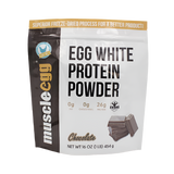 A package of MuscleEgg White Egg Protein Powder, with a net weight of 16 oz (453g), featuring 26g of protein per serving and 0g of fat per serving, with a cupcake illustration on the front.