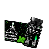 A bottle of Extreme Mint Smelling Salts by Project M, featuring a green label with text and a QR code, and an illustration of a skeleton sitting cross-legged surrounded by mint leaves.